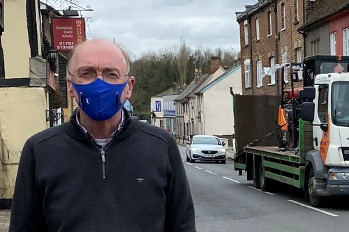 Robert Spivey in street wearing mask